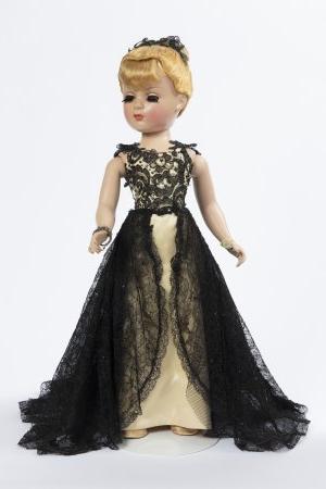 Photo of a doll in a black dress. 